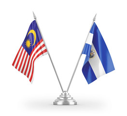 El Salvador and Malaysia table flags isolated on white 3D rendering