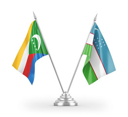 Uzbekistan and Comoros table flags isolated on white 3D rendering