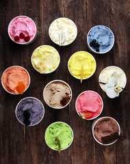 Various of ice cream flavor whit fresh blueberry, strawberry, kiwi, lemon, vanilla setup on rustic background . Summer and Sweet cold ice cream