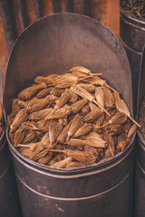 Morocco Marrakech Medina, trade in spices and paints in jars in a market in the old city. Everyday life in Africa.