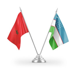 Uzbekistan and Morocco table flags isolated on white 3D rendering