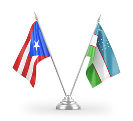 Uzbekistan and Puerto Rico table flags isolated on white 3D rendering