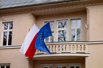 Polish and European Union flags on a building which serves as consulate - obrazy, fototapety, plakaty