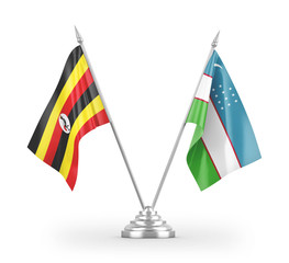 Uzbekistan and Uganda table flags isolated on white 3D rendering