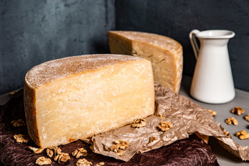 Big yellow part of goat cheese heads on a blue background.