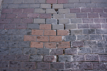 Broken pavement stones street road top view