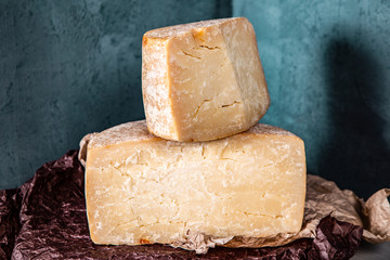 Big yellow part of goat cheese heads on a blue background