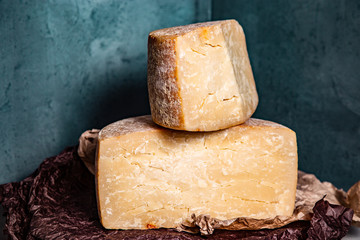 Big yellow part of goat cheese heads on a blue background