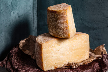 Big yellow part of goat cheese heads on a blue background