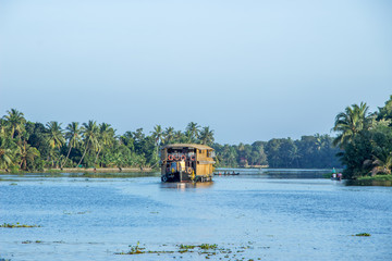 A shot of Wooden boat house floating in Alleppey waters