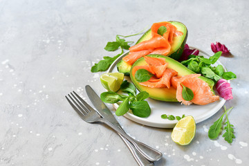 Popular keto diet : salmon and avocado  with arugula and lime. healthy lunch. ketogenic diet  food