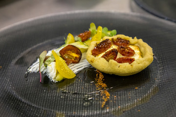 mini tarts on a plate with cream