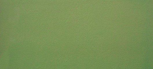 Old vintage, painted wall. Background or backdrop for something in green.