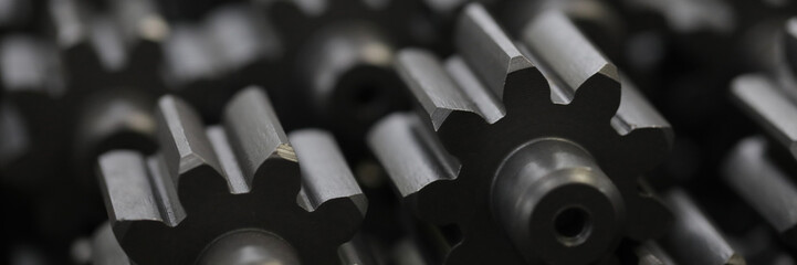 Close-up of metal cogs nested in new modern factories for rapid and transit production of different of details .Automotive manufacturing process concept