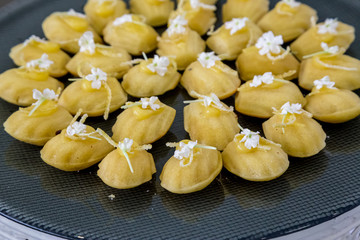 Madeleine's on a tray with flowers sweat pastries