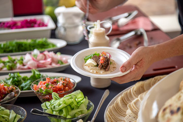 waiter serving food in restaurant