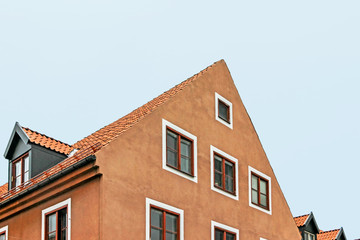 Fototapeta na wymiar exterior facade of old orange building in visby sweden