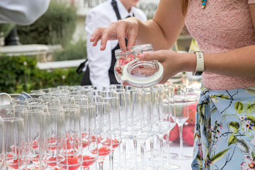 glasses with watermelon red peppercorns and flowers