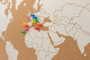 World map of cork showing European and North African areas with colored pushpins · destinations · visited places · colored pushpins marking places · distant View ·Atlantic Ocean, Europe
