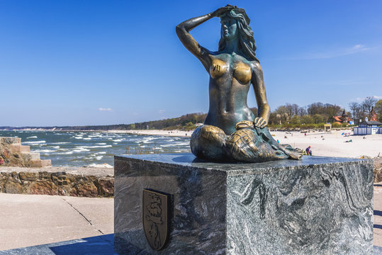 Ustka, Poland - May 13, 2017: Mermaid sculpture on breakwater in Ustka town located on the Baltic Sea coast