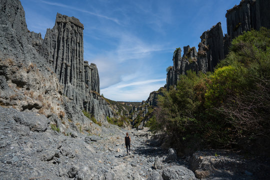 A tourist stands among the rock formations at the Putangirua Pinnacles in the Wairarapa near Wellington New Zealand 