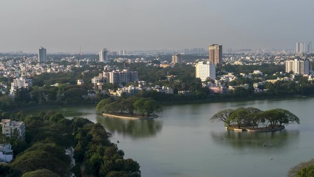  Time Lapse of Large Lake in Downtown Bangalore With Rowing Boats Passing Through