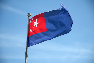 Johor flag wave in the blue sky