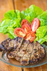 grilled pork steak with tomato and vegetable
