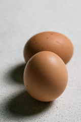 Still life egg on a white plate on a dark background