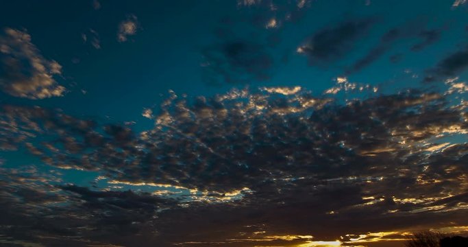 Time lapse at the Kings Canyon, Australia. Amazing colorful sunrise at the Kings Canyon Resort Campground at the Wakarra national park northern territory Australia. Fast moving clouds in the morning 