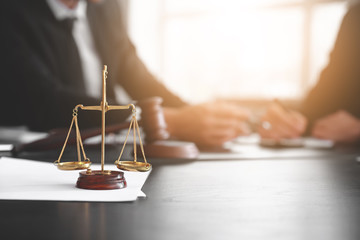 Scales of justice on table of notary public in office