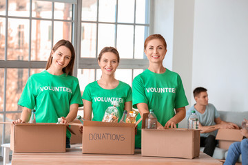 Team of volunteers with products indoors