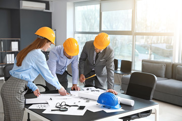 Group of engineers working in office