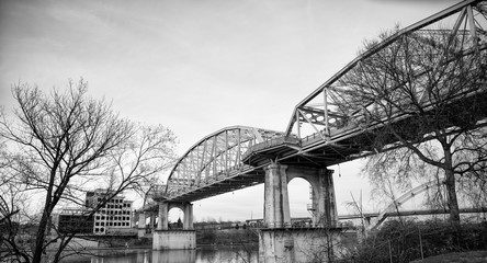 Black and White image of traditional bridge across water over sky in Nashville Tennessee, USA