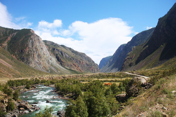 Mountain river valley landscape. River valley in the mountains. Mountain river landscape. View of the valley of a mountain river from the top of the mountain.