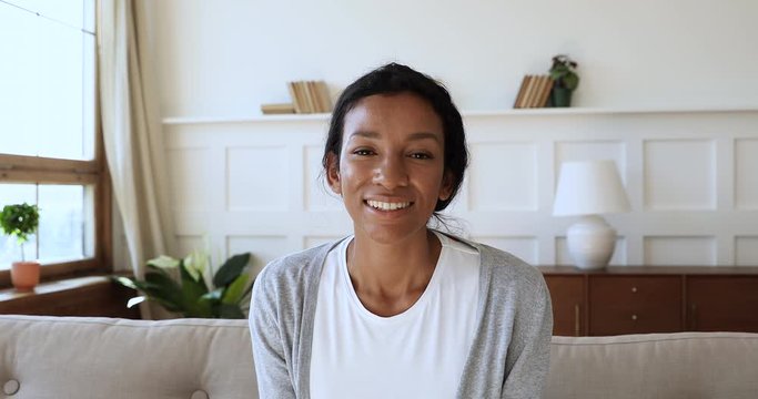 Happy african american woman holding video call with friends.