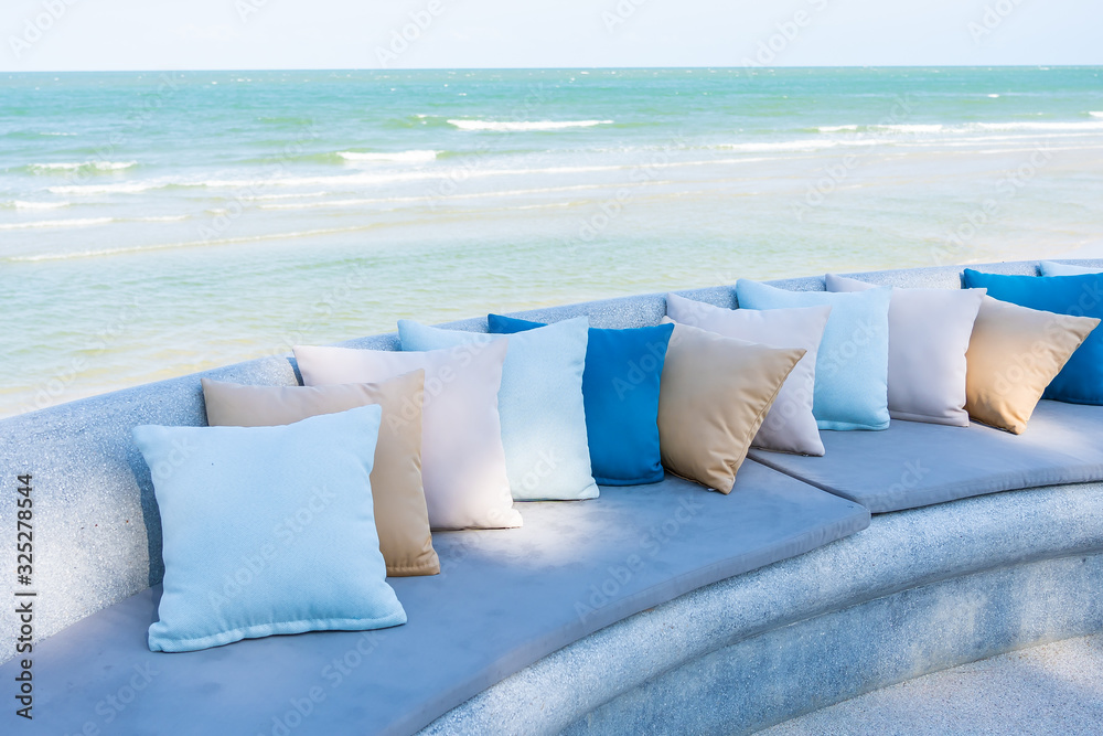 Wall mural pillow on chair or sofa lounge around outdoor patio with sea ocean beach view