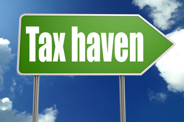 Tax haven word with green road sign