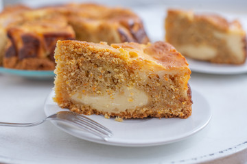 home made carrot cake cheesecake on a table
