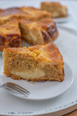 home made carrot cake cheesecake on a table