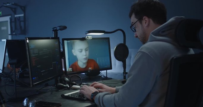 Programmer talking with a boy via a VoIP call