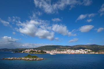 Naklejka na ściany i meble Skiathos island , the most famous island of Greece is one of the most famous Greek destinations in the whole world, here we see a view of the island from a ship. Famous for its beaches, one of the bes