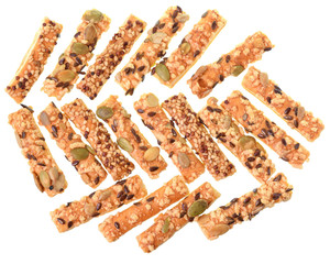 Mini seeded straws topped with cheese and seeds top view