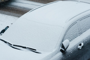 car covered with snow, winter time