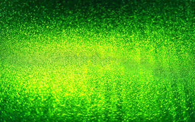 Green background. St Patricks day. Abstract twinkled bright background with bokeh defocused golden lights.