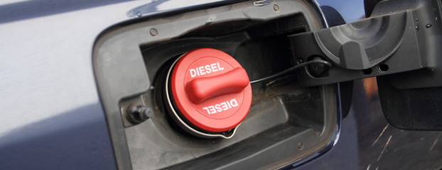 a red fuel cap with the inscription 