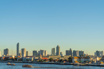 In Bangkok with Chao Phraya River, Thai temple and Skyscraper in Bangkok city, Thailand.