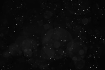 Obraz na płótnie Canvas snow black background abstract texture, snowflakes falling in the sky overlay