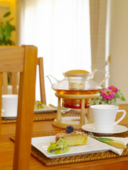 tea set with homemade fruit tart in dining room