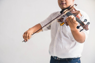Symphony orchestra on white background, hands playing violin. Male violinist playing classical...